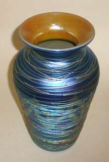 11 1/4 tall, iridescent art glass vase, with pulled feather and 