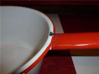 These enamelware pots and pans are in very good vintage condition.