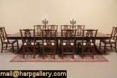 This palatial mahogany polished dining table includes a classic 