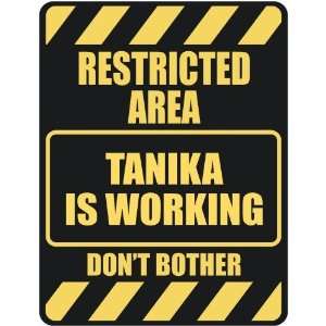   RESTRICTED AREA TANIKA IS WORKING  PARKING SIGN