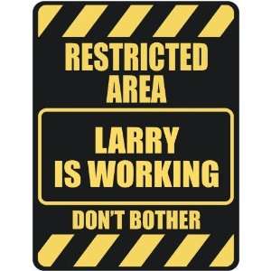   RESTRICTED AREA LARRY IS WORKING  PARKING SIGN