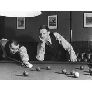  Snooker Player Prepares to Play a Shot as His Partner 