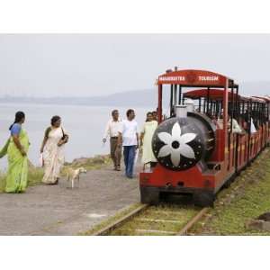  People Walk Next to Miniature Train Near Elephanta Island 