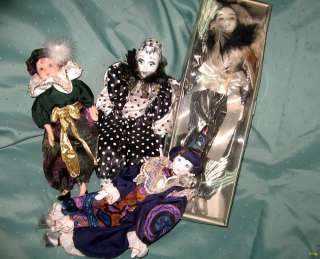   we are glad to offer you a lot of four exquisite Harlequin dolls