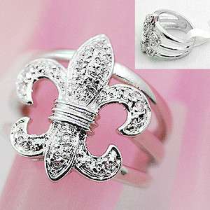   studded fleur de lis solitaire ring WITH  size 9  