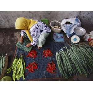  A Woman Sells Vegetables at an Open Air Market in Malaysia 